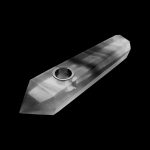 Clear glass pipe against a black background.