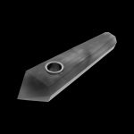 Black crystal pipe against a black background.