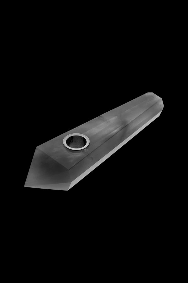 Black crystal pipe against a black background.