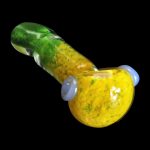 A side view of the SC Tri-Color Frit Flat Spoon Pipe, showcasing its vibrant, colorful frit pattern on a smooth, curved form.