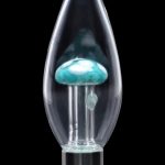 A front view of the SC Mini Egg with Mushroom Perc Nectar Collector, showcasing its clear glass construction and unique mushroom perc design.