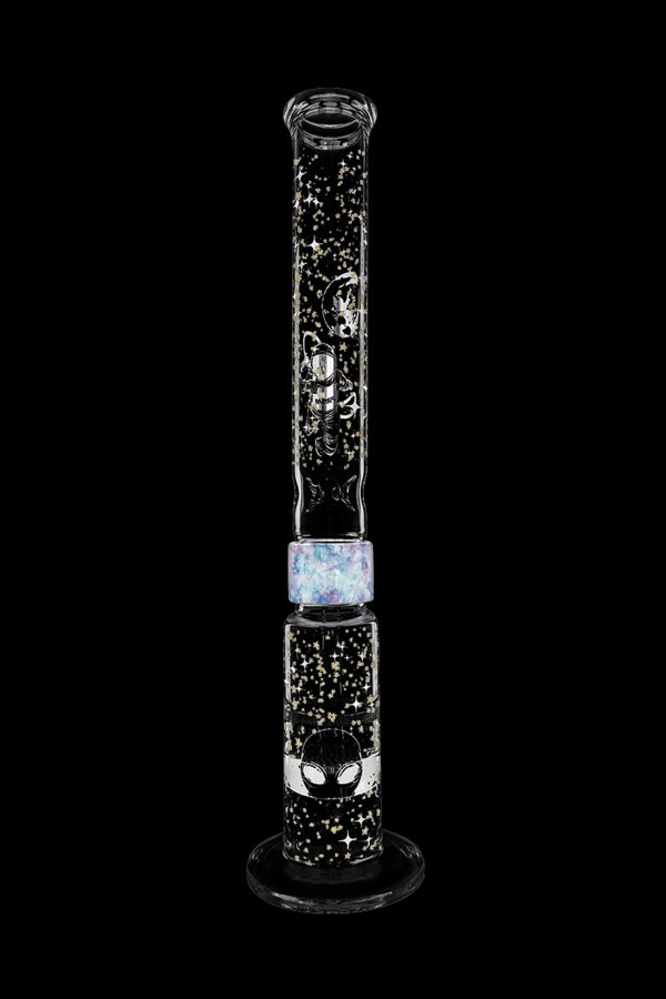 Glass water pipe with a spider and web design, iridescent opal accents, and black speckled detailing, set against a black background.