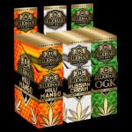 A stack of 25 Billionaire Hemp Wraps, displayed at a slight angle against a dark background, showcasing the colorful packaging.