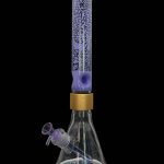 A vibrant, patterned glass bong with a purple and teal color scheme.