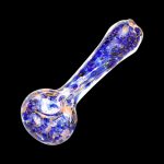 A side view of the Blue & Gold Fumed Swirl Spoon Pipe, showcasing its curved shape and golden shimmer against a dark background.