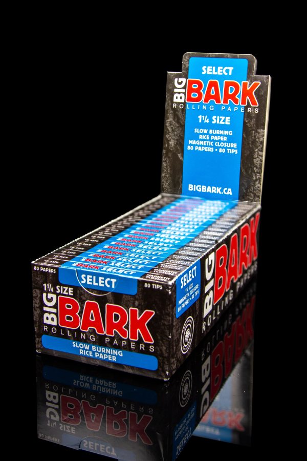 A display box of “Select Bark” 1 ¼ size slow-burning rice rolling papers and tips, with branding in blue, red, and white.