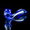 Blue glass pipe with cannabis leaf design, isolated on black.