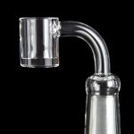 Clear quartz banger for vaporizing cannabis concentrates, against a black background.