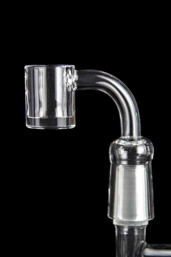 Clear quartz banger for vaporizing cannabis concentrates, against a black background.