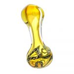 A slightly angled view of the Chains of Binding Glass Spoon Pipe, showing its smooth yellow glass form and curved bowl.