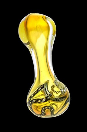 A side view of the Chains of Binding Glass Spoon Pipe, featuring swirling amber glass in a curved design.