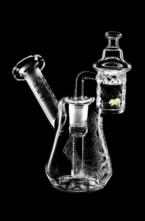Front view of the Compact Travel Etched Dab Rig Set, a small, clear glass rig with detailed etched designs and a visible bowl.