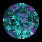 A circular tray with a cosmic cannabis leaf pattern, featuring teal, purple, and glitter accents, with a brand logo at the center.
