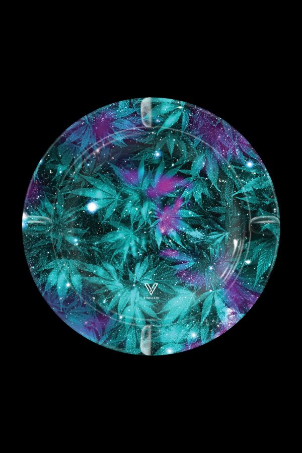 A circular tray with a cosmic cannabis leaf pattern, featuring teal, purple, and glitter accents, with a brand logo at the center.
