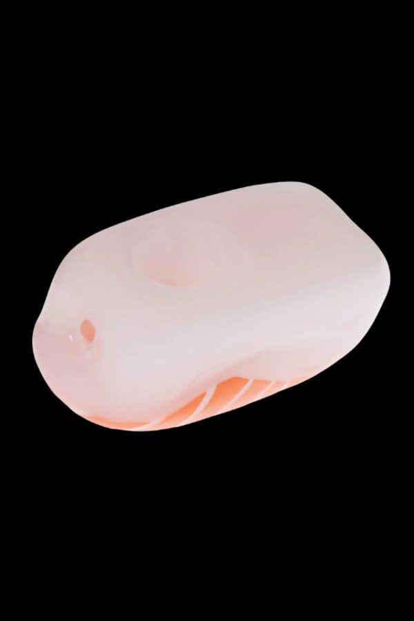 Peach-colored silicone carb cap for cannabis concentrates.