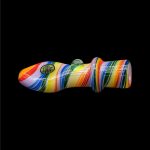Colorful glass cannabis pipe isolated on a black background.