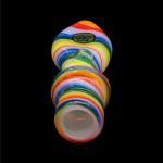 Colorful glass water pipe isolated on a black background.