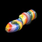 Colorful glass pipe isolated on a black background.