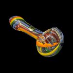 Colorful glass pipe isolated on a black background.