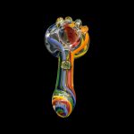 Colorful glass pipe isolated on a black background.