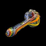 Colorful glass smoking pipe isolated on a black background.