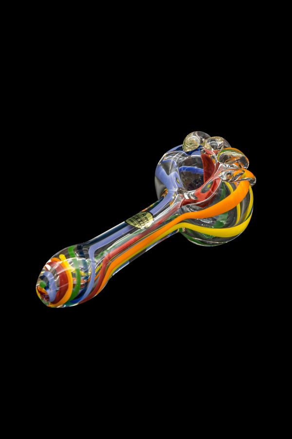 Colorful glass smoking pipe isolated on a black background.
