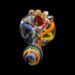 Hand-blown glass cannabis pipe with colorful swirls against a black background.