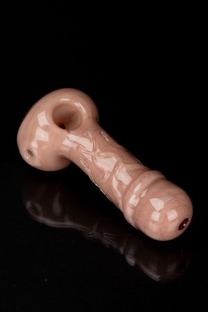 Peach-colored glass pipe with etched floral design, studio shot on a black reflective surface.