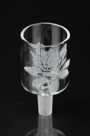Etched glass cannabis bowl with floral design, studio shot.