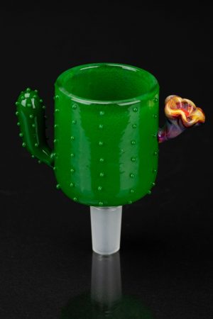 Green glass cactus-shaped smoking piece with a floral accent, studio shot on black.