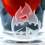 Frosted cannabis leaf design on a glass pipe submerged in water, with a red cap visible above.