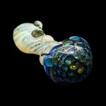 Hand-blown glass pipe with a speckled blue and green bowl, against a black background.