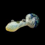 Glass cannabis pipe with iridescent blue and cream swirls on a black background.