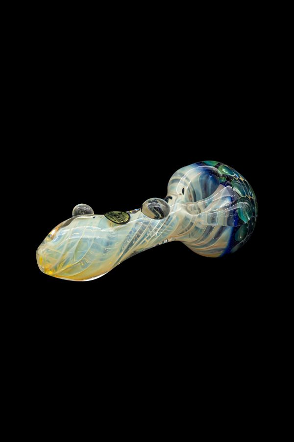 Glass cannabis pipe with iridescent blue and cream swirls on a black background.