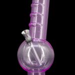 Purple glass bong with illuminated base.