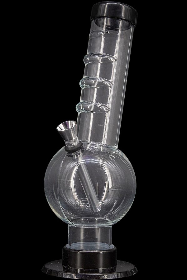Clear glass water pipe (bong) with a flared base and textured downstem, isolated on a black background.