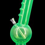 Green glass water pipe (bong) isolated on black.