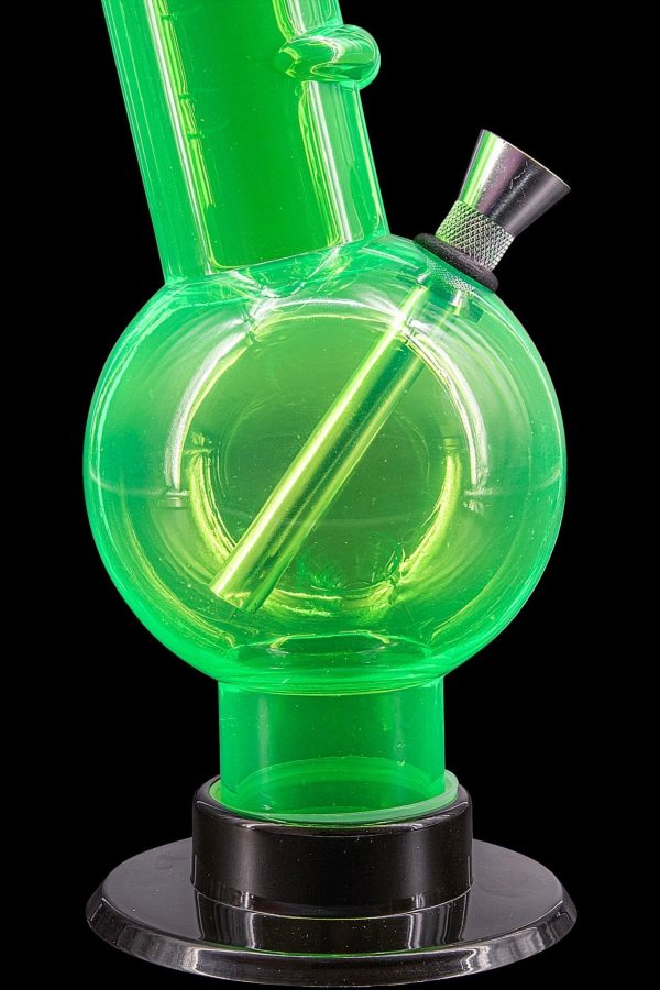 Green glass bubbler water pipe with black base.