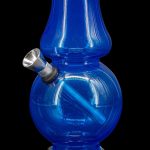 Blue glass water pipe (bong) with metallic downstem and base.