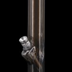 Black glass water pipe with metallic accents, studio shot.