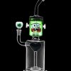 Glass water pipe shaped like Frankenstein's monster with a clear base and green head, isolated on a black background.