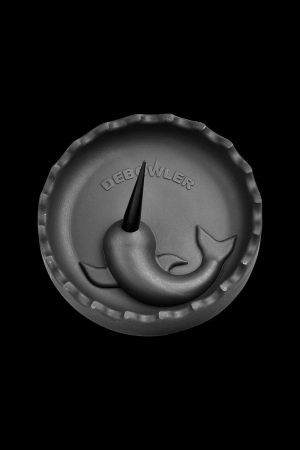 A top-down view of the Debowler Narwhal Silicone Ashtray, featuring a dark grey, whale-shaped design.