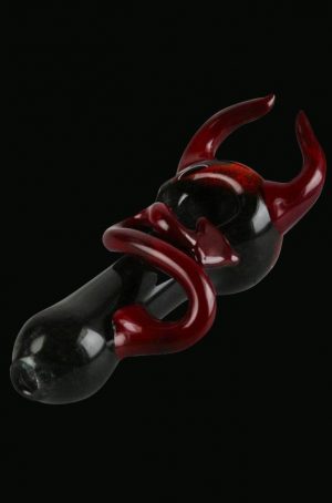 A side view of the Devil Horns and Tail Fritted Spoon Pipe, showcasing its detailed glasswork and unique sculpted design.