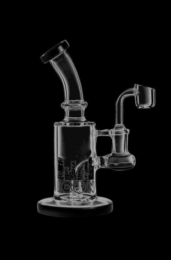 A three-quarter view of the Diamond Glass 'Hobbit' Dab Rig, featuring a clear glass construction and a curved neck for dabbing.