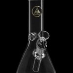 Clear glass beaker bong with a red rim and all-seeing eye logo.