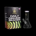 A glass beaker bong, known as the “Daily Driver Beaker” by Ritual, is displayed in its packaging with a psychedelic swirling design.