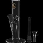Glass water pipe (bong) with intricate skeletal design, accompanied by a downstem and glass bowl, isolated on a black background.