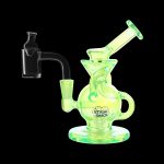 Glowing green glass dab rig with a quartz banger, branded “Stash Shack.”