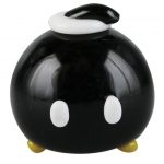 The Empire Glassworks Time Bomb Spoon is shown in a close-up, front view with a rounded shape and dark glass.