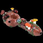 The Empire Glassworks Spoon Pipe - Nature displays a detailed, hand-blown glass pipe adorned with colorful mushroom-shaped accents.